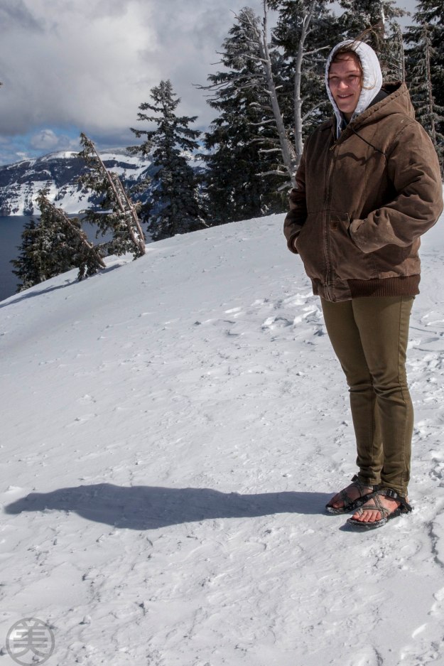 Young girl standing by Crater Lake view point with bare feet...!